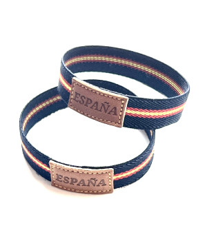 Tubo 25 pulseras de España bandera ancha color azul